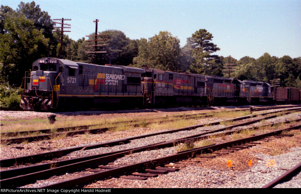 SBD 5721 holds a northbound train at the North Raleigh yard signal
